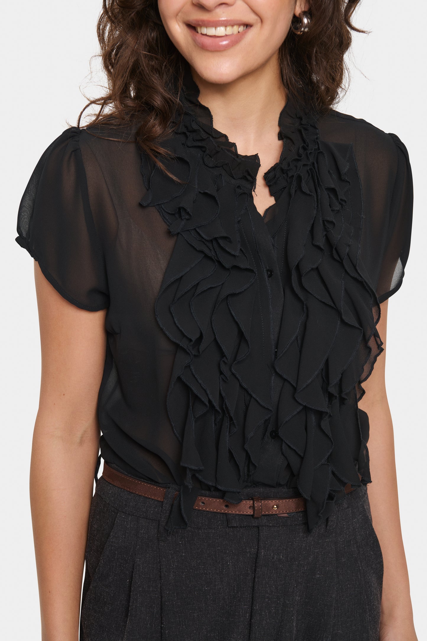 woman wearing the lilja blouse in black by Saint Tropez