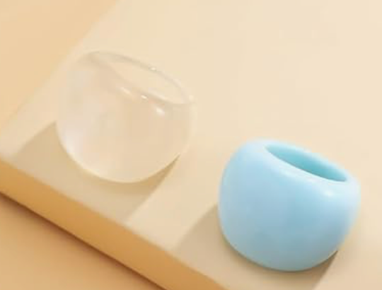Blue silicone ring on a beige surface