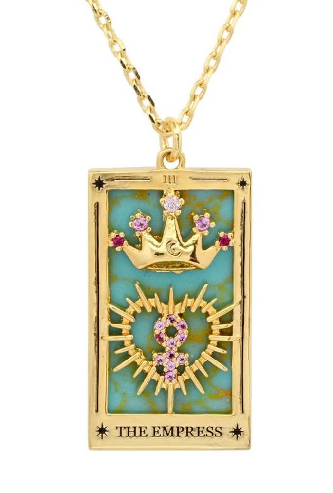Gold pendant with 'The Empress' tarot card design on a teal enamel background