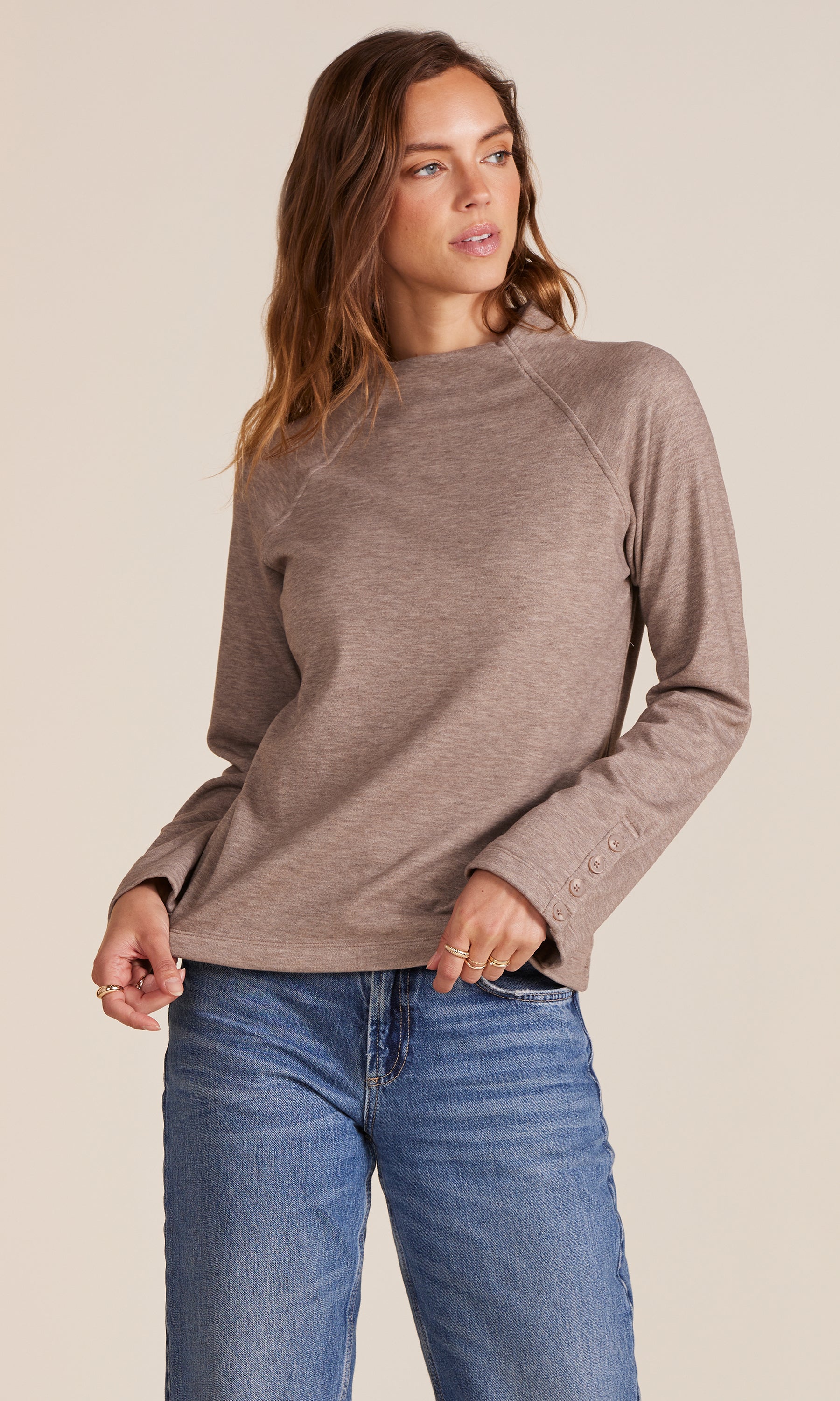 woman wearing a Raglan sleeve top in grey 