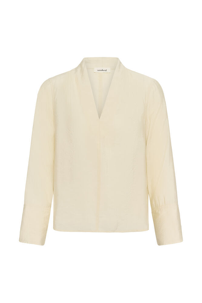 Leodora V-Neck Blouse by Soaked in Luxury in Pistachio Shell by Soaked in Luxury