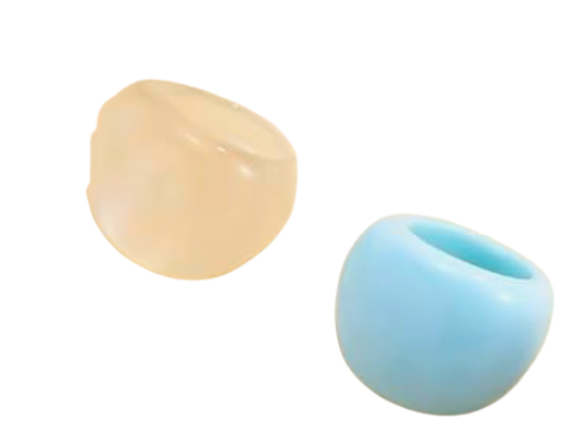 Beige and blue rings on a white surface
